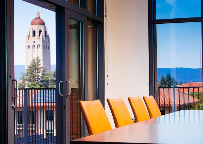 Table and chairs in empty conference room at Stanford University.