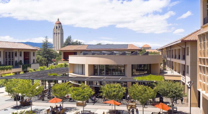 Students walking outside at Stanford Graduate School of Business.